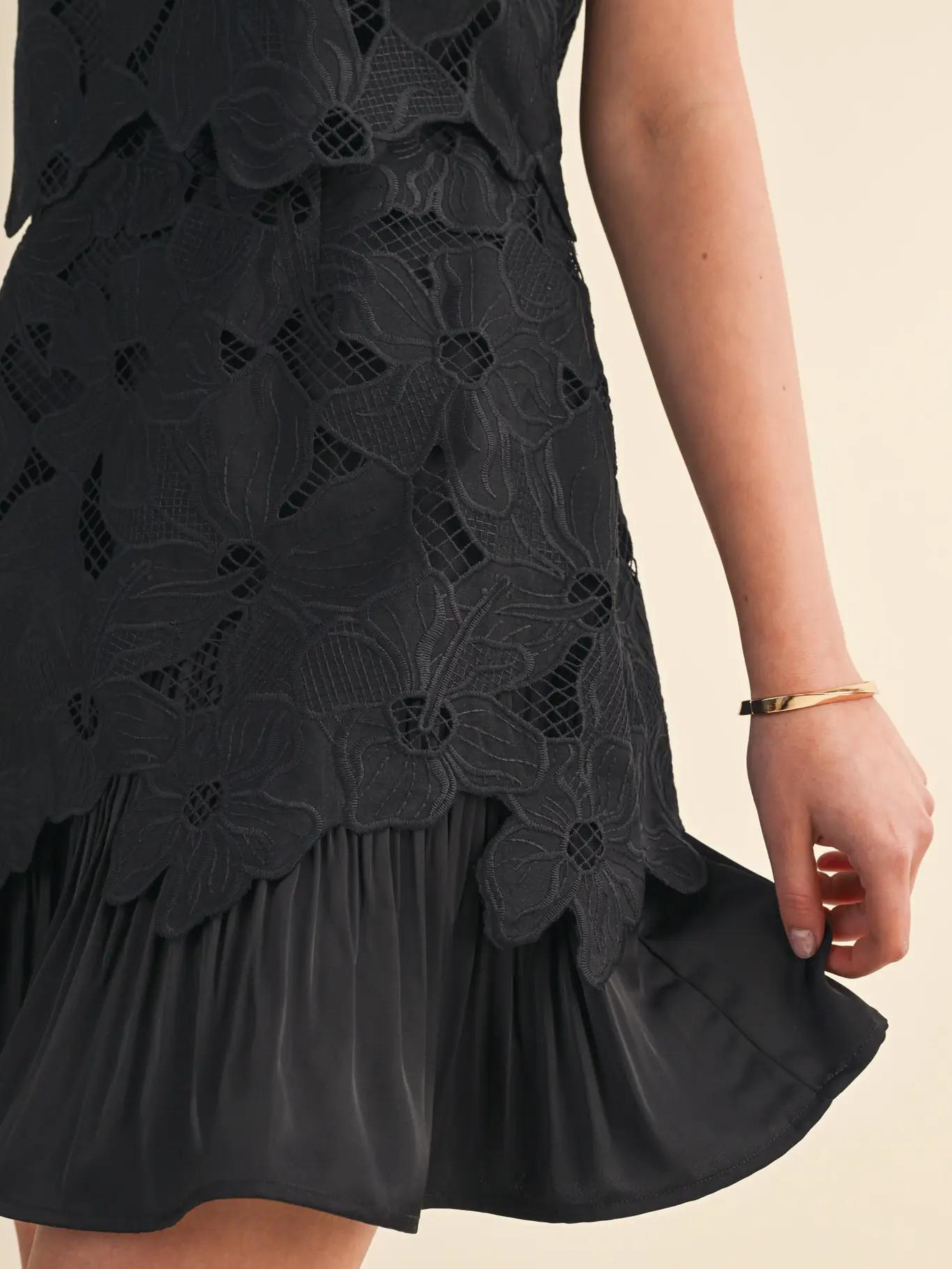 Black mini dress with lace and silk lining.