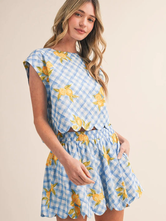 Two piece blue white and yellow set against white background. 