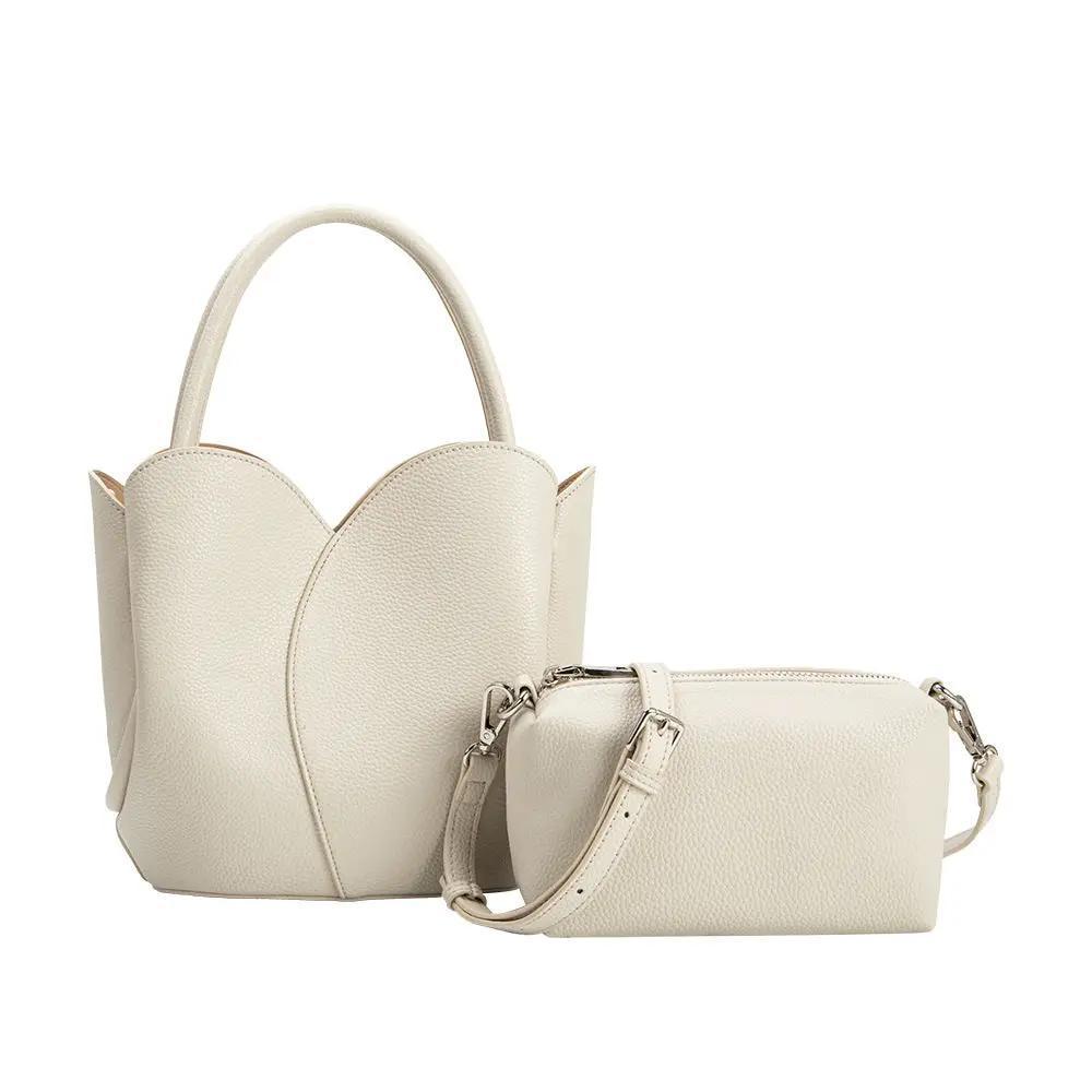 off-white purse with trap and insert included. 