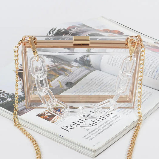 Clear bag with gold chain and clear chain. 