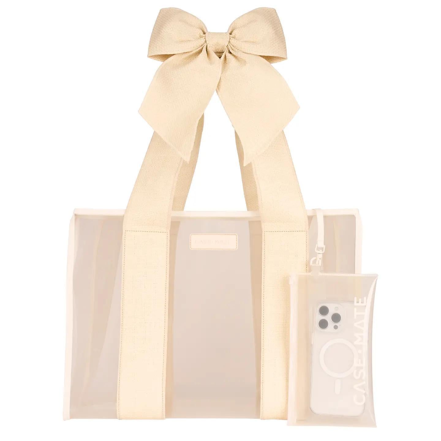 beige bag with big bow and phone case with phone inside. 