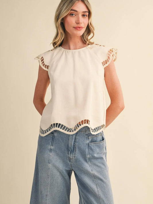 Girl in white shirt and jeans against white background. 
