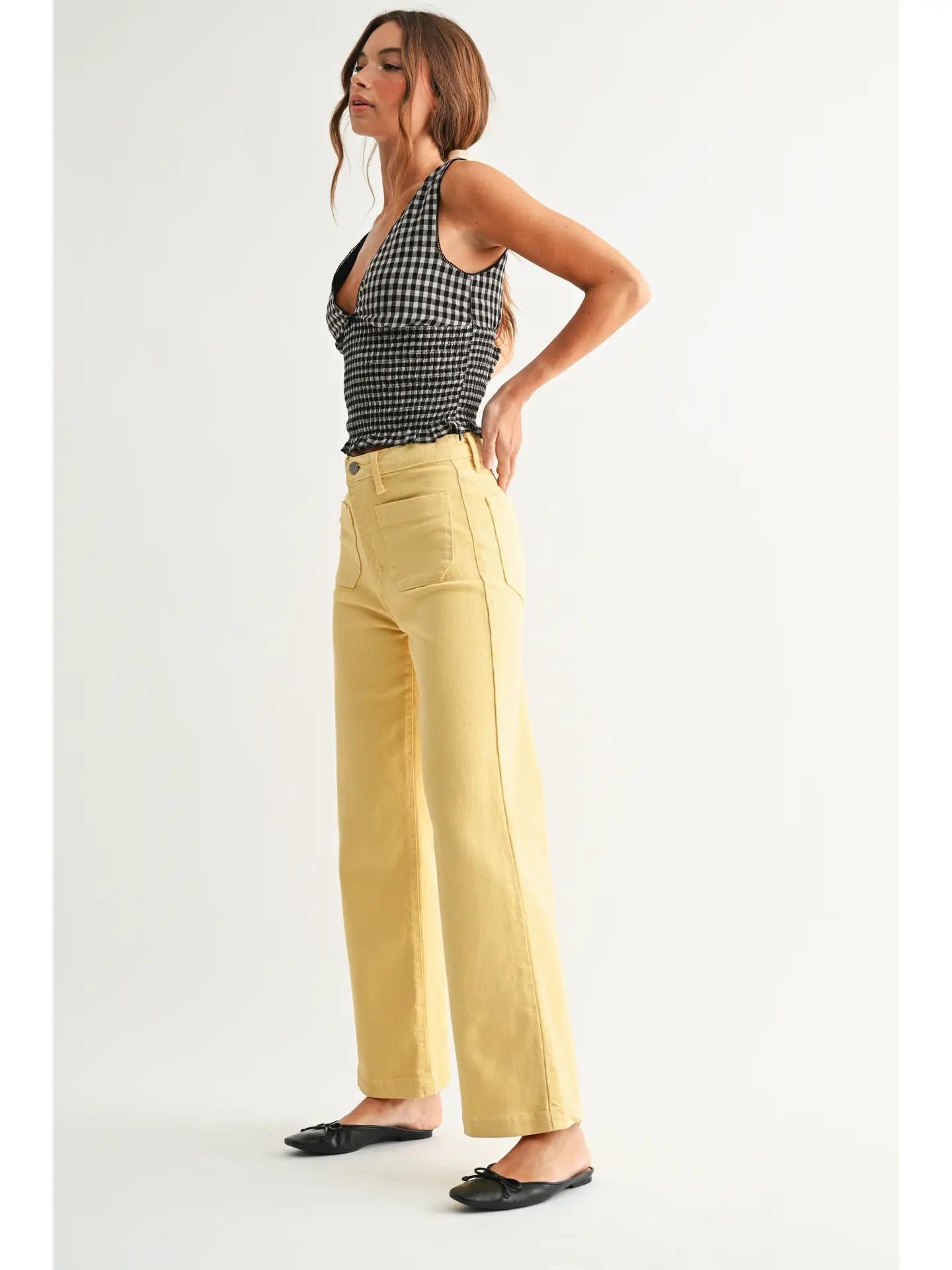 Black gingham top and yellow jeans with a black leather ballet flat. 