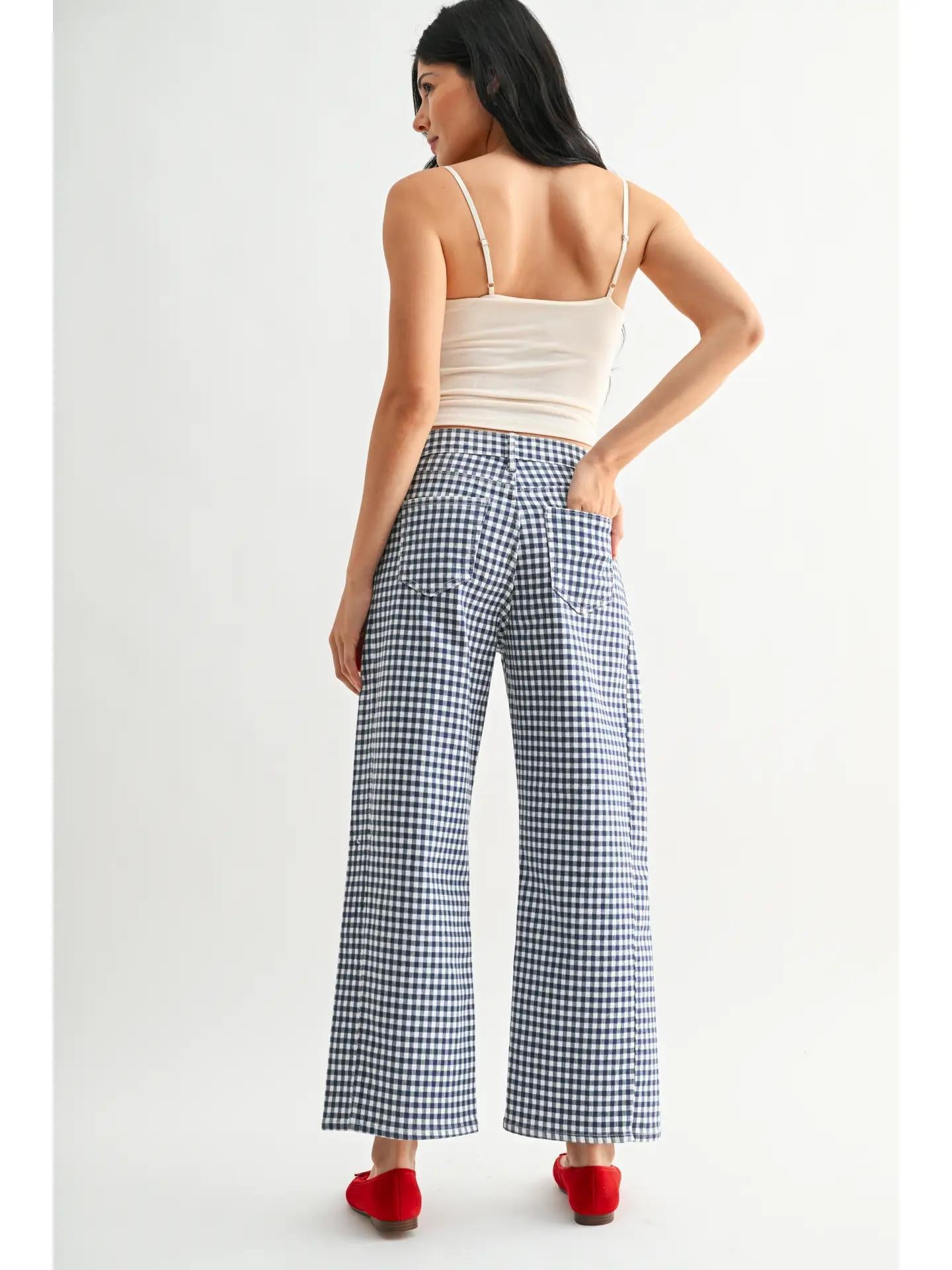 Trendy red ballet flats navy gingham barrels shaped jeans and a white top. 