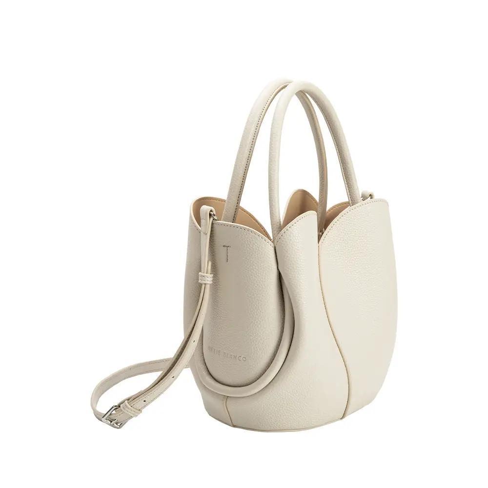 Off-white purse with long strap included. 
